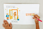 Load image into Gallery viewer, Inside lift‑the‑flap page from the bilingual Hindi–English children’s book Pay It Forward showing Hindi Script and Transliteration and English text for early readers and a child tracing the Hindi script to learn how to write using a dry-erase marker and its dry-erase writeable pages.

