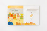 Load image into Gallery viewer, Inside lift‑the‑flap page from the bilingual Hindi–English children’s book Pay It Forward showing a grocery store and a hand vocabulary word with Hindi Script and Transliteration and English text for early readers.
