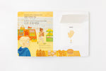 Load image into Gallery viewer, Inside lift‑the‑flap page from the bilingual Korean–English children’s book Pay It Forward showing a grocery store and hand vocabulary word with Korean Hangul and English text for early readers.
