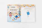 Load image into Gallery viewer, Inside lift‑the‑flap page from the bilingual Mandarin Chinese–English children’s book Pay It Forward showing a library and a book vocabulary word with simplified Chinese Pinyin and English text for early readers.
