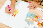 Load image into Gallery viewer, Inside lift‑the‑flap page from the bilingual Mandarin Chinese–English children’s book Pay It Forward showing Mandarin Chinese and English text for early readers and a child tracing the Mandarin to learn how to write using a dry-erase marker and its dry-erase writeable pages.
