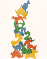 Load image into Gallery viewer, Wooden Chinese Zodiac Animals stacked on top of each other, showing the smooth wood finish, detailed carving, and playful balancing design of all 12 zodiac figures. Extra challenge to stack the figures in the order of the zodiac animals.
