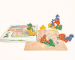 Load image into Gallery viewer, Full set of Wooden Chinese Zodiac Animals displayed in the puzzle‑board packaging, with additional carved wooden figures stacked on top and arranged around the Zodiac Wheel guide board to show play value and craftsmanship.
